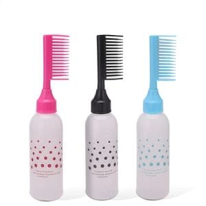 Hair oil applicator for distributing oil on the scalp and stimulating growth
